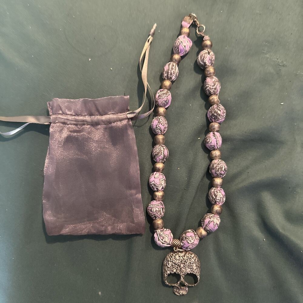 String Beaded Necklace Made In Mexico. Purple With Skull Pendant